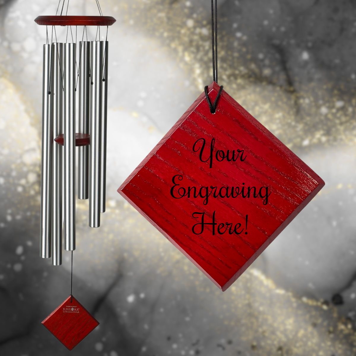 Woodstock brand 'Chimes of the Eclipse' SILVER aluminum tubes wind chime that is 37 inches in length, with customizable red wooden wind sail displayed in front of a landscape background