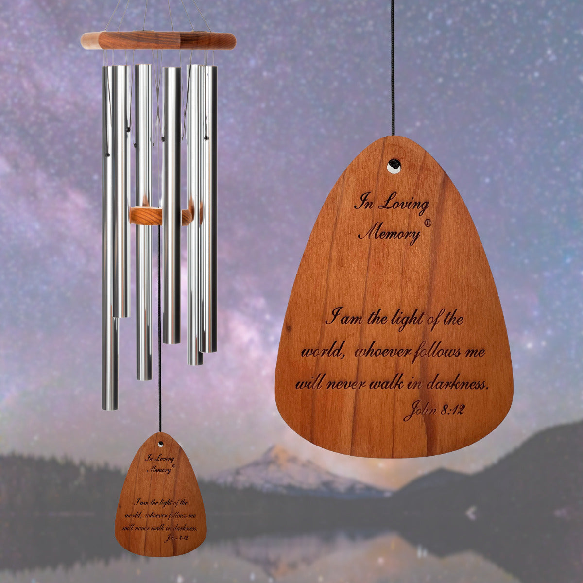 In Loving Memory BRAND wind chime THAT IS 35 inches WITH SILVER ALUMINUM TUBES PRE-ENGRAVED with THE QUOTE, "I am the light of the world, whoever follows me will never walk in darkness - John 8:12" ON THE WIND SAIL DISPLAYED IN FRONT OF A LANDSCAPE BACKGROUND