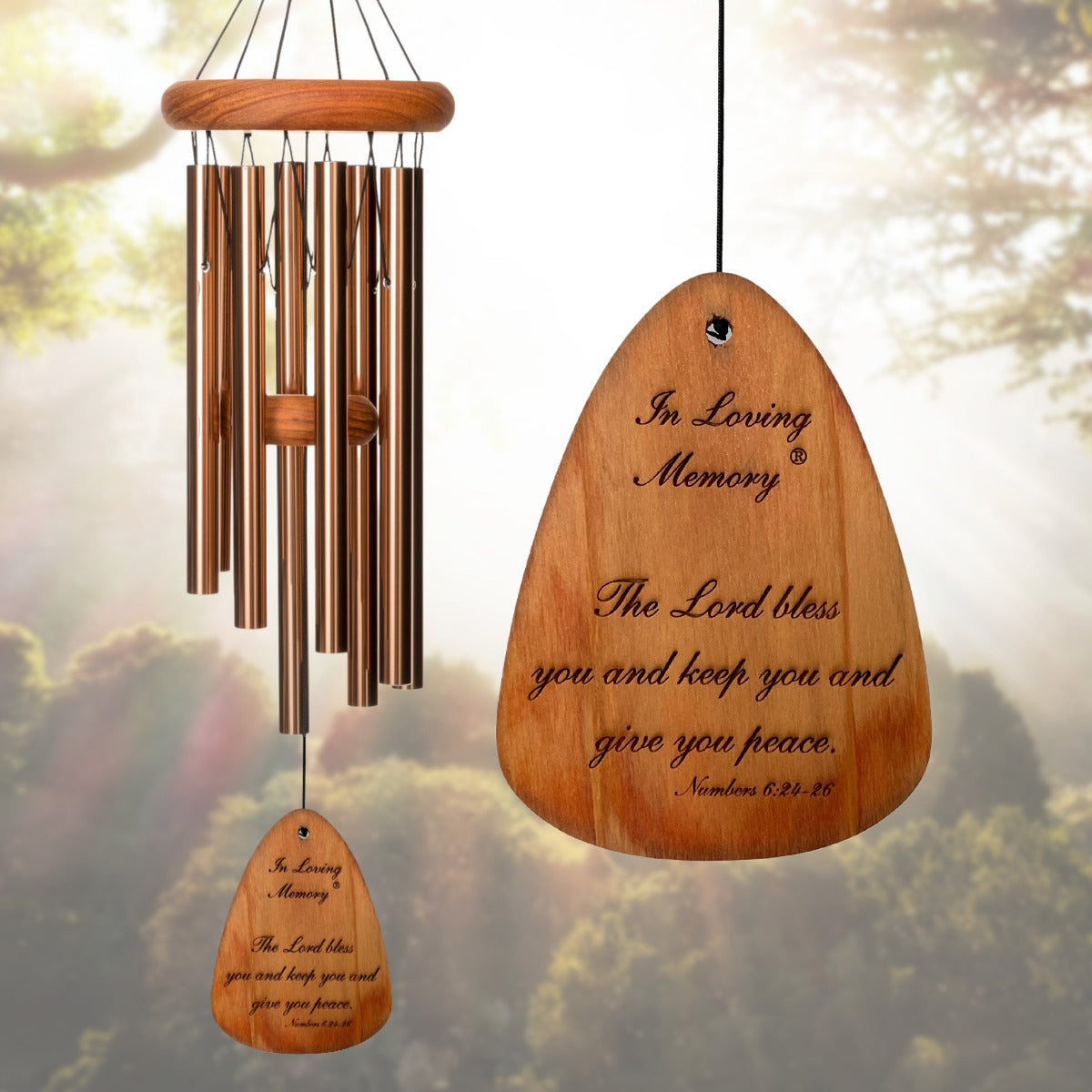 In Loving Memory BRAND wind chime THAT IS 18 inches WITH BRONZE ALUMINUM TUBES PRE-ENGRAVED with THE QUOTE, "THE LORD BLESS AND KEEP YOU AND GIVE YOU PEACE. NUMBERS 6:24-26" ON THE WIND SAIL, ALL OF WHICH IS DISPLAYED IN FRONT OF A LANDSCAPE BACKGROUND