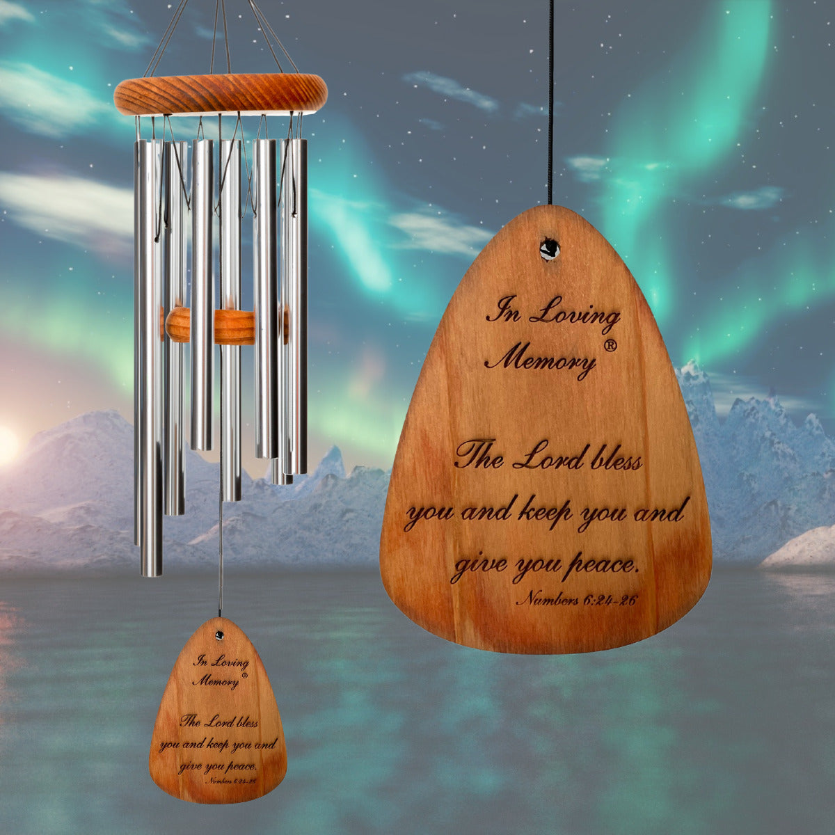 In Loving Memory BRAND wind chime THAT IS 18 inches WITH SILVER ALUMINUM TUBES PRE-ENGRAVED with THE QUOTE, "THE LORD BLESS AND KEEP YOU AND GIVE YOU PEACE. NUMBERS 6:24-26" ON THE WIND SAIL, ALL OF WHICH IS DISPLAYED IN FRONT OF A LANDSCAPE BACKGROUND