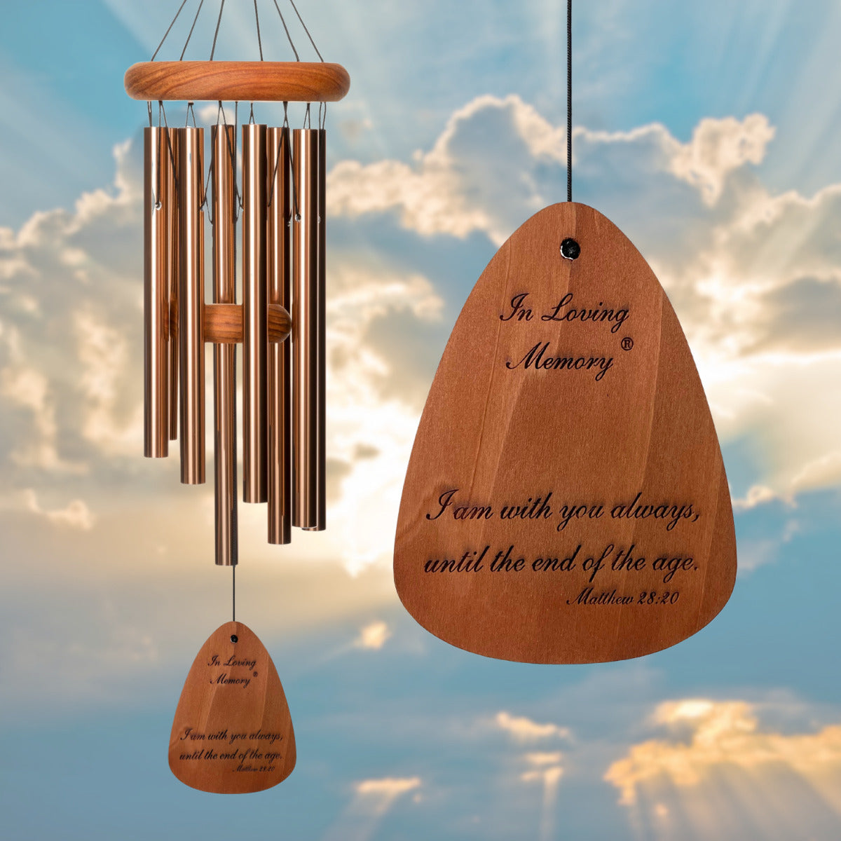 In Loving Memory BRAND wind chime THAT IS 18 inches WITH BRONZE ALUMINUM TUBES PRE-ENGRAVED with THE QUOTE, "I AM WITH YOU ALWAYS, UNTIL THE END OF THE AGE. MATTHEW 28:20" ON THE WIND SAIL, ALL OF WHICH IS DISPLAYED IN FRONT OF A LANDSCAPE BACKGROUND