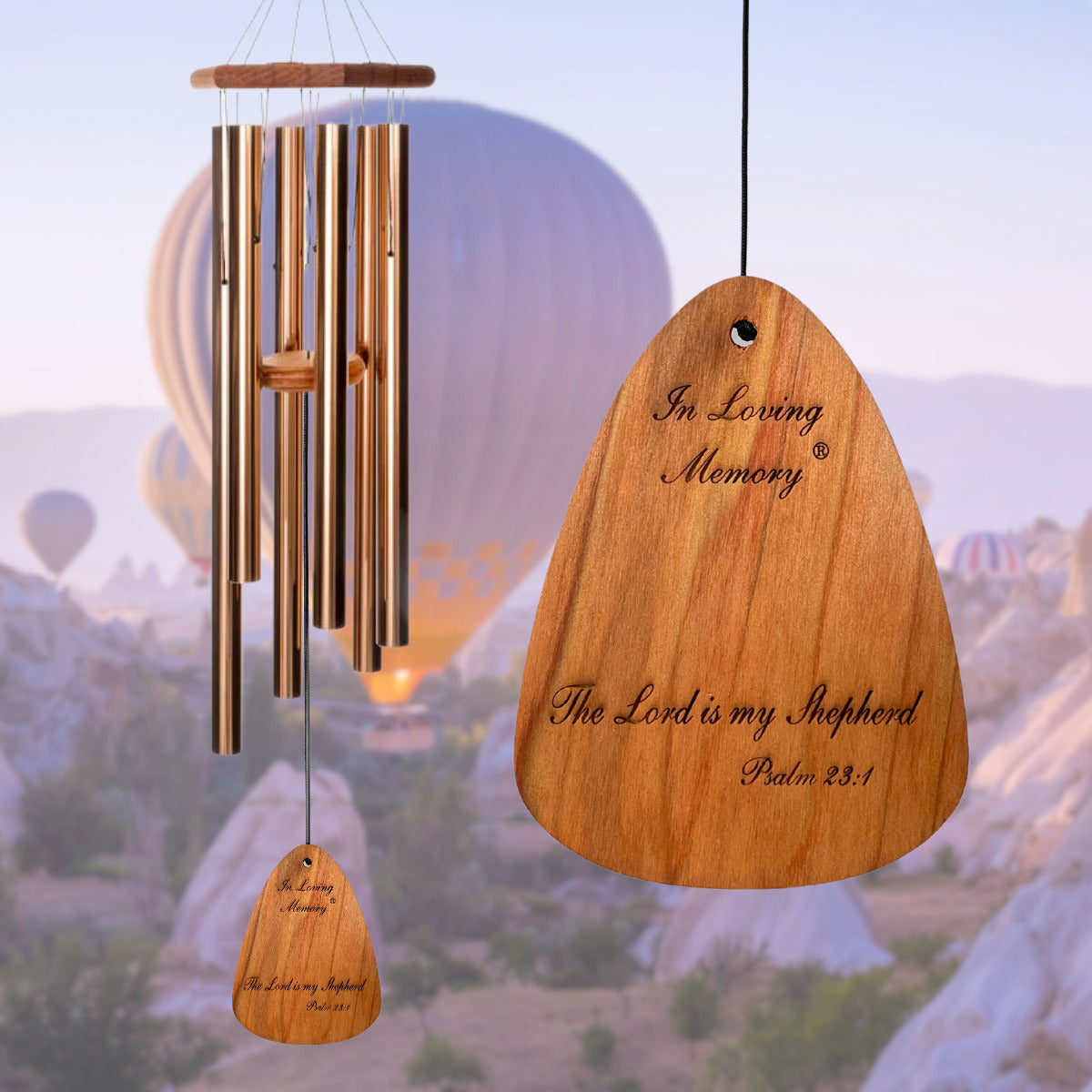 In Loving Memory 42 inch bronze wind chime with "In Loving Memory The Lord is my Shepherd Psalm 23:1" inscribed on the wind sail, on a scenic hot air balloon background