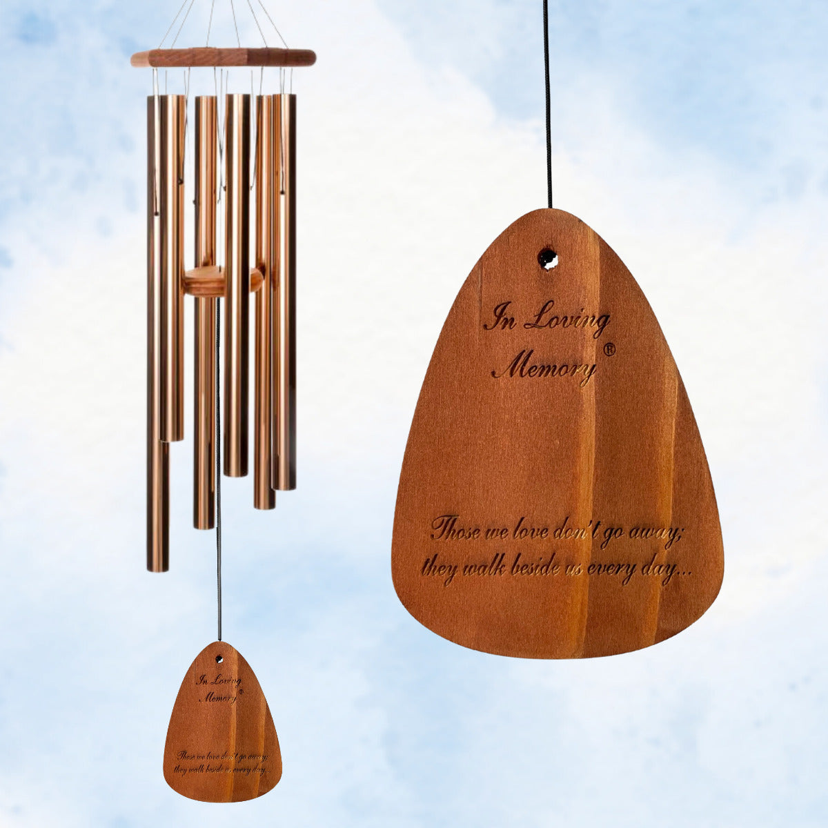 In Loving Memory 42 inch bronze wind chime with "Those we love don't go away, they walk beside us every day" message against a blue sky background