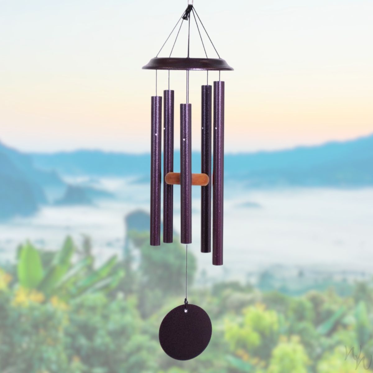 Shenandoah brand wind chime that is colored plum, 29 inches, has 5 aluminum tubes, and a wooden striker displayed in front of a landscape background