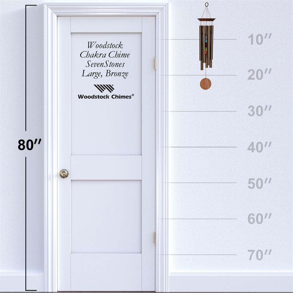 Woodstock Chimes CHAKRA BRONZE WIND Chime displayed on a white door with height measurement scale