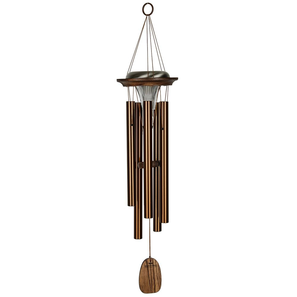Woodstock Chimes Moonlight Solar Chime in bronze finish, featuring six aluminum tubes, a solar-powered LED light, a customizable wind sail, and o ring hook on a white background