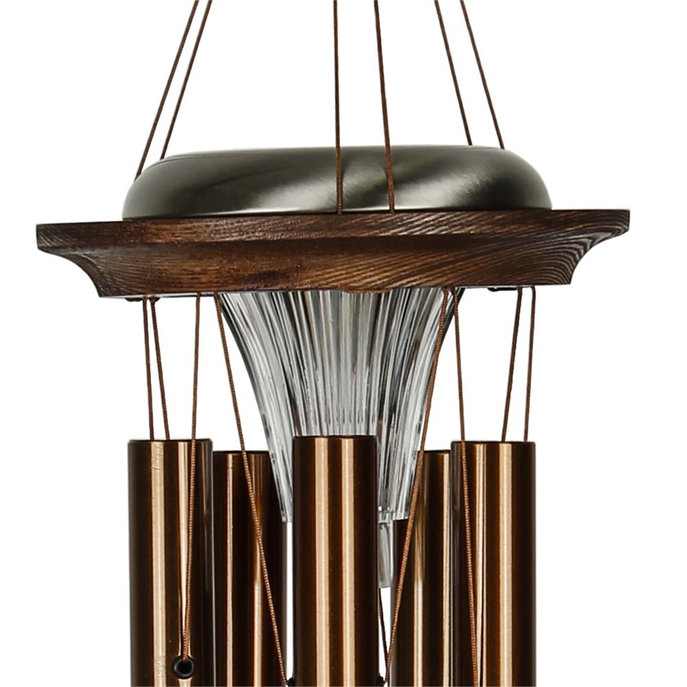 Close up of Woodstock Chimes Moonlight bronze Solar Chime solar-powered LED light on a white background
