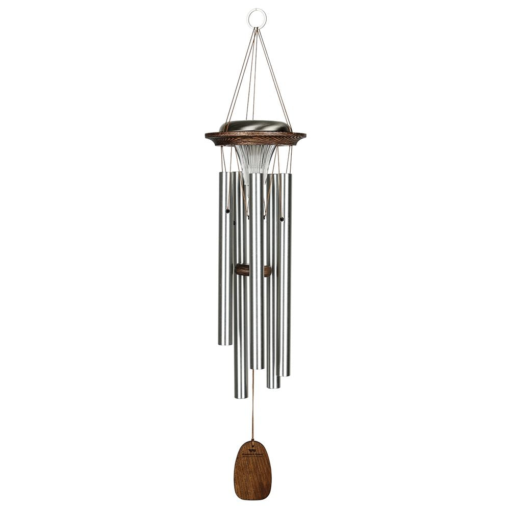 Woodstock Chimes Moonlight Solar Chime in silver finish, featuring six aluminum tubes, a solar-powered LED light, a customizable wind sail, and o ring hook on a white background