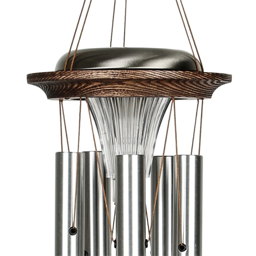 Close up of Woodstock Chimes Moonlight silver Solar Chime solar-powered LED light on a white background