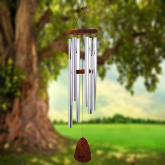 Festival 36 inch silver wind chime with wooden striker and wind sail, hanging from a tree with a natural background