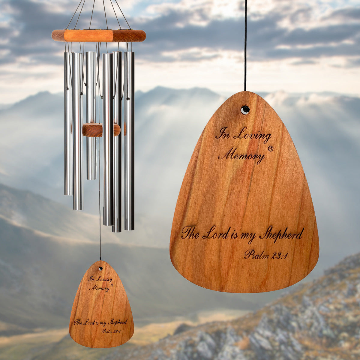 In Loving Memory BRAND wind chime THAT IS 30 inches WITH SILVER ALUMINUM TUBES PRE-ENGRAVED with THE QUOTE, "THE LORD IS MY SHEPHERD. PSALM 23:1" ON THE WIND SAIL, ALL OF WHICH IS DISPLAYED IN FRONT OF A LANDSCAPE BACKGROUND