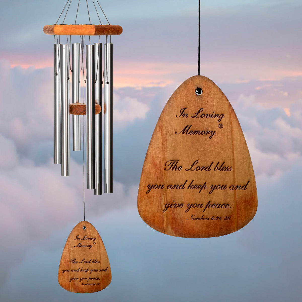 In Loving Memory BRAND wind chime THAT IS 30 inches WITH SILVER ALUMINUM TUBES PRE-ENGRAVED with THE QUOTE, "THE LORD BLESS AND KEEP YOU AND GIVE YOU PEACE. NUMBERS 6:24-26" ON THE WIND SAIL, ALL OF WHICH IS DISPLAYED IN FRONT OF A LANDSCAPE BACKGROUND