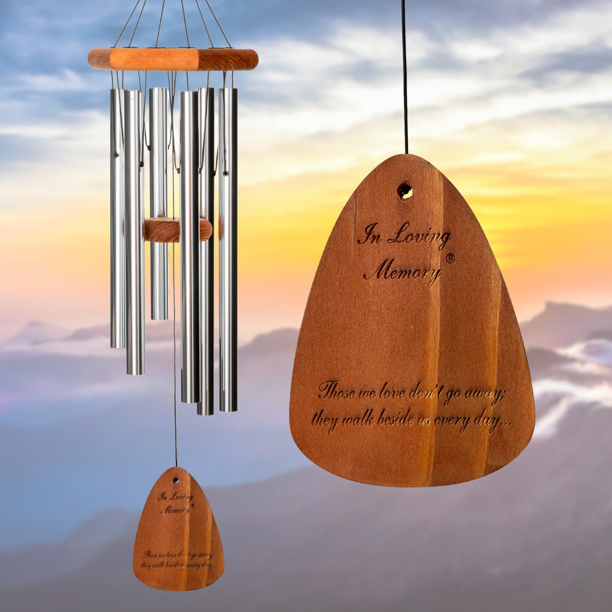 In Loving Memory BRAND wind chime THAT IS 30 inches WITH SILVER ALUMINUM TUBES PRE-ENGRAVED with THE QUOTE, "THOSE WE LOVE DON'T GO AWAY; THEY WALK BESIDES US EVERY DAY..." ON THE WIND SAIL, ALL OF WHICH IS DISPLAYED IN FRONT OF A LANDSCAPE BACKGROUND