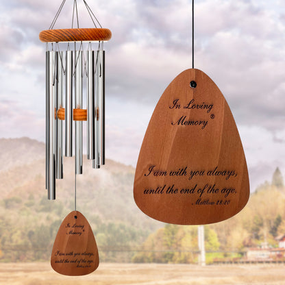 In Loving Memory BRAND wind chime THAT IS 18 inches WITH SILVER ALUMINUM TUBES PRE-ENGRAVED with THE QUOTE, "I AM WITH YOU ALWAYS, UNTIL THE END OF THE AGE. MATTHEW 28:20" ON THE WIND SAIL, ALL OF WHICH IS DISPLAYED IN FRONT OF A LANDSCAPE BACKGROUND