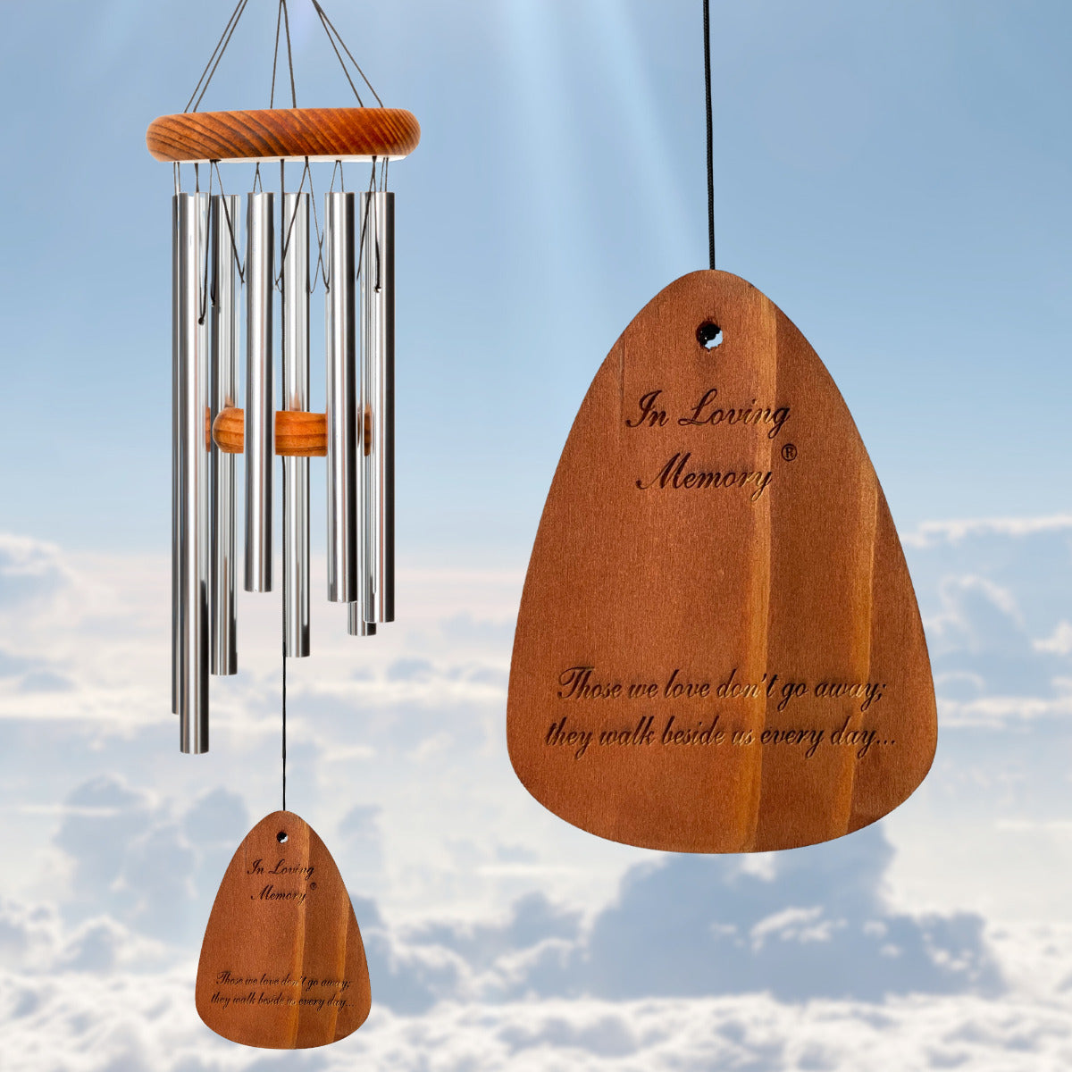 In Loving Memory BRAND wind chime THAT IS 18 inches WITH SILVER ALUMINUM TUBES PRE-ENGRAVED with THE QUOTE, "THOSE WE LOVE DON'T GO AWAY; THEY WALK BESIDE US EVERY DAY..." ON THE WIND SAIL, ALL OF WHICH IS DISPLAYED IN FRONT OF A LANDSCAPE BACKGROUND