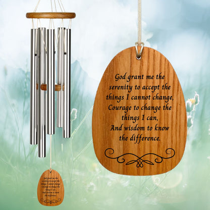 Woodstock Reflections Serenity Prayer wind chime with engraved text that reads "God grant me the serenity to accept the things I cannot change,
Courage to change the things I can,
And wisdom to know the difference." on a blurred natural background