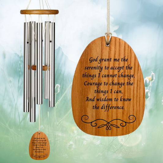 Woodstock Reflections Serenity Prayer wind chime with engraved text that reads "God grant me the serenity to accept the things I cannot change,
Courage to change the things I can,
And wisdom to know the difference." on a blurred natural background