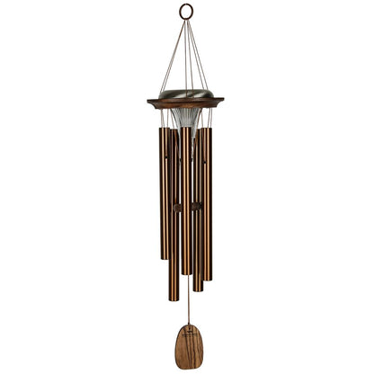 Woodstock Chimes Moonlight Solar Chime in bronze finish, featuring six aluminum tubes, a solar-powered LED light, a customizable wind sail, and o ring hook on a white background