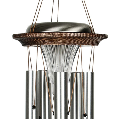 Close up of Woodstock Chimes Moonlight silver Solar Chime solar-powered LED light on a white background