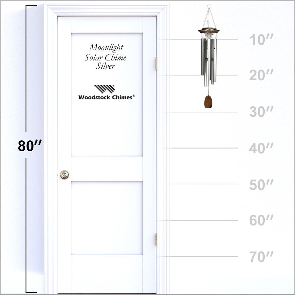 Woodstock Chimes Moonlight Silver Solar Chime displayed on a white door with height measurement scale