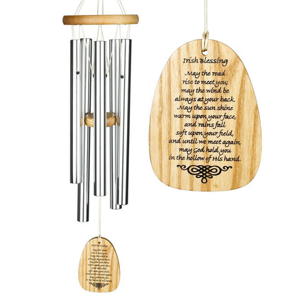 Woodstock Reflections silver wind chime, light wood striker and wind sail, with engraved text that reads " Irish Blessing May the road rise to meet you; May the wind be always at your back. May the sun shine warm upon your face, And rains fall soft upon your field, And until we meet again, May God hold you in the hollow of His hand." on a white background